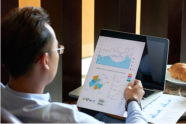 rear-view-man-seated-armchair-cafe-analyzing-diagrams-charts-before-presentation